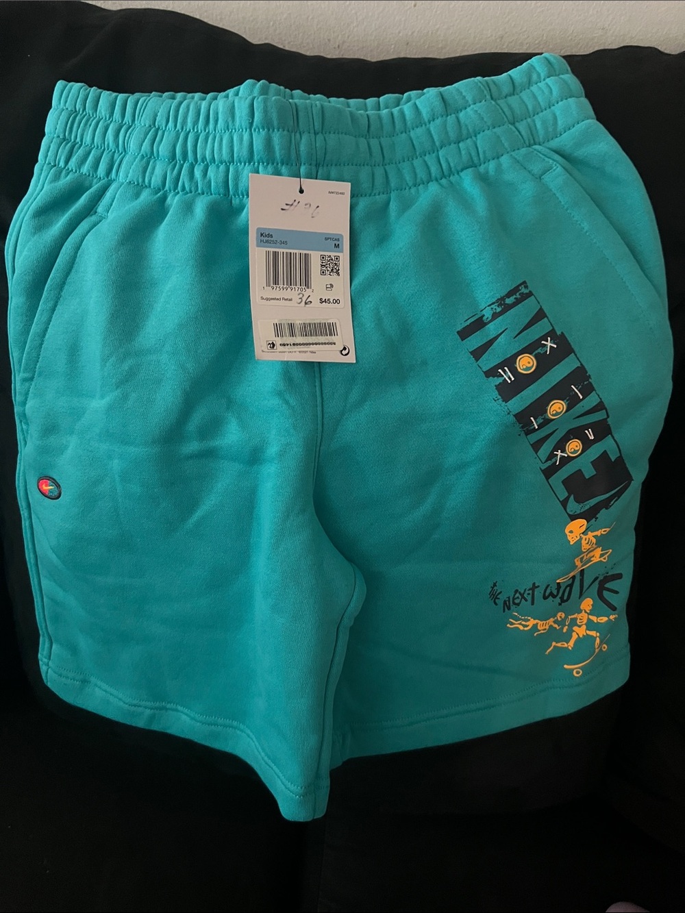 Nike Teal Athletic Shorts with Graphic Accents